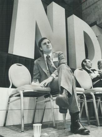 Easily returned as leader of Ontario New Democratic Party, Stephen Lewis listens to speeches at three-day convention, which ended last night