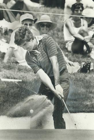 A real blast: Bruce Lietzke, who blasted out of his sand trap in good form, got a bigger blast later on - a cheque for $50,000 for winning the Canadian Open at Glen Abbey near Oakville