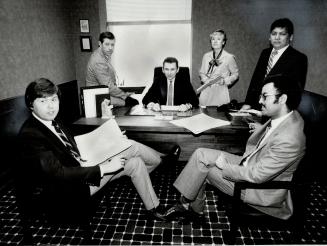 The team: Complaints commissioner Sidney Linden, seated centre, with his investigators, from left: Steve Lechnewsky, Ed Singleton, Philomena Stanway, Lorenzo Mendoza and Astaw Seife