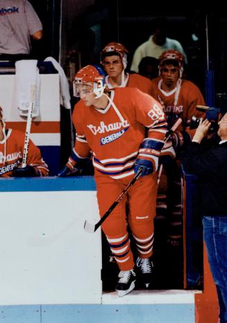 He's back: Eric Lindros steps out on to the ice at the Oshawa Civic Auditorium last night