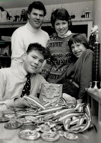 Support group: Carl and Bonnie Lindros, with children Brett (left) and Robin, are as much a part of Eric Lindros' success story as the 16-year-old is himself