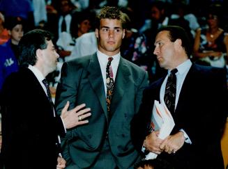 Seeing stars: Eric Lindros was rocked in a collision with Brent Sutter.