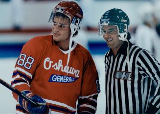 Eric Lindros and linesman Bob Bell shared a chuckle at the Civic Auditorium on Sunday during Number 88's first start of the season for the Generals