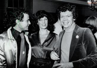 Party time: CITY-TV president Moses Znaimer (left), You're Beautiful host Micki Moore and City Lights host Brian Linehan have fun at the TV station's Christmas bash
