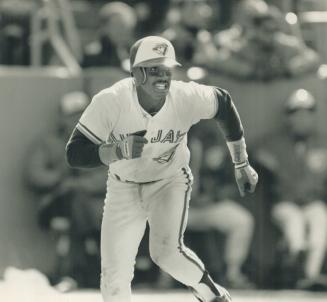 Oh so close: The Jays' Nelson Liriano heads for first after breaking up the no-hit bid of Nolan Ryan, right, with one out in the ninth yesterday.