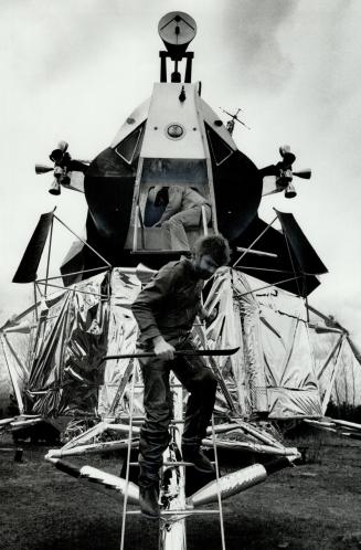 Space invader: Oshawa area artist Bill Lishman descends from his life-sized replica of the U