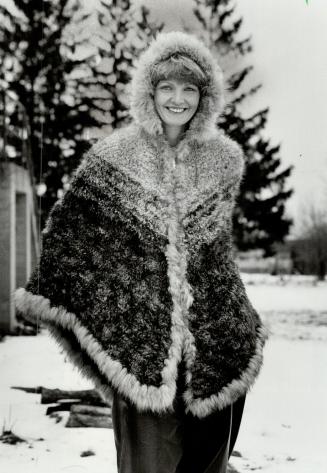 Fur fashions: Textile artist Paula Lishman models a cape made by knitting fur, which means the fur is inside as well
