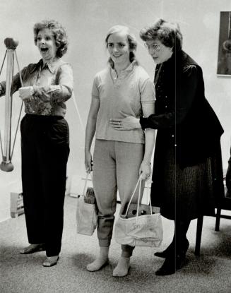 Nothing orthodox: Gwenlynn Little (left) pulls on a gadget called a Bullworker while student Jane Gooderheart (centre) lugs two bags of bricks and Lois McDonall feels her diaphragm in a scene typifying the seemingly strange exercises at their studios in Toronto