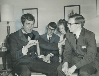 Rich Little, one of Canada's top showbiz personalities, gives some advice and encouragement to Dave Grey, a student who hopes to emulate Rich's success as an actor and impersonator