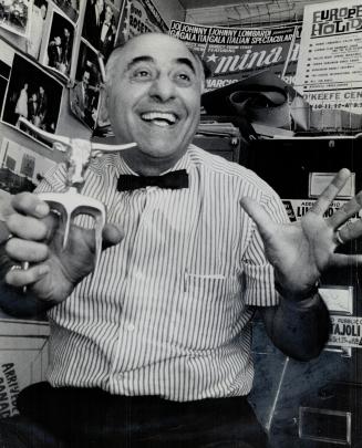 Impresario Lombardi in his store. He holds a good luck charm