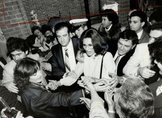 Sophia Loren: Mobbed by admires, the raven-haired actress shakes hands and returns greetings on her way to an award ceremony in North York