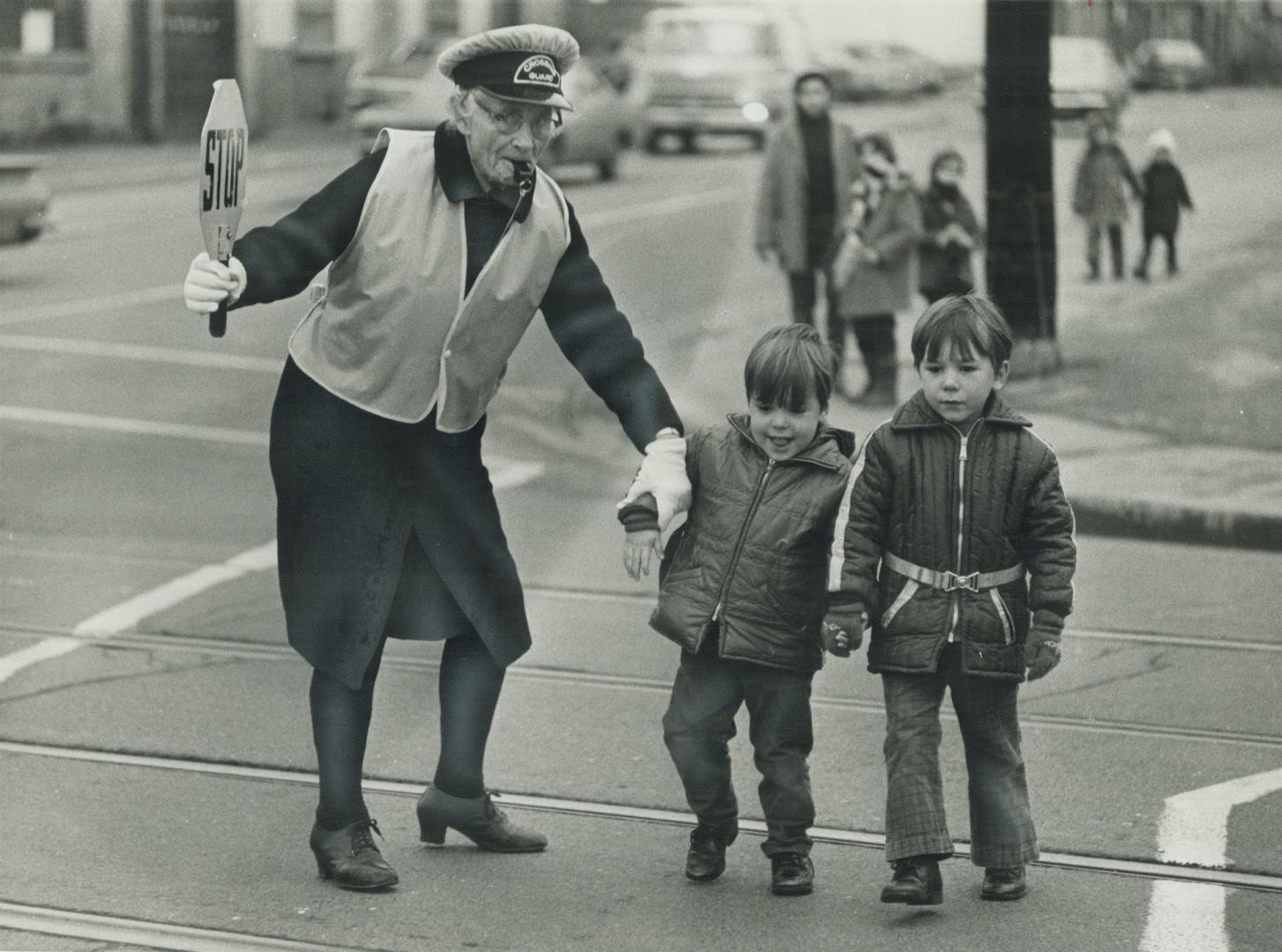 87 years old, Viola Lowe is unchallenged as the city's senior crossing guard, getting children safely across King and Niagara Sts