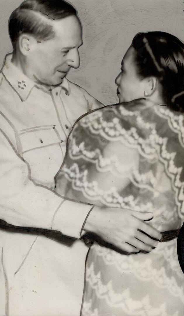 General MacArthur, back in Manila as he promised, greets the wife of the newly installed Philippines President Osmena.