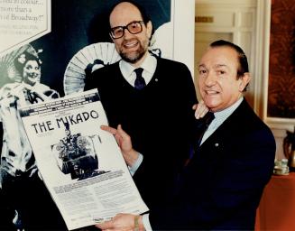 King St. clan: Choreographer Brian Macdonald and regular financial backer Ed Mirvish with posters for The Mikado, which gamered a pair of Tony Award nominations for Macdonald. The choreographer plans to take The Mikado to Australia next year.