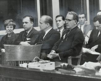 Donald C. MacDonald (Right) at the Dodatto inquest last night. Behind him is Metro Coroner Dr. Morton Shulman, on his right MPP James Renwick