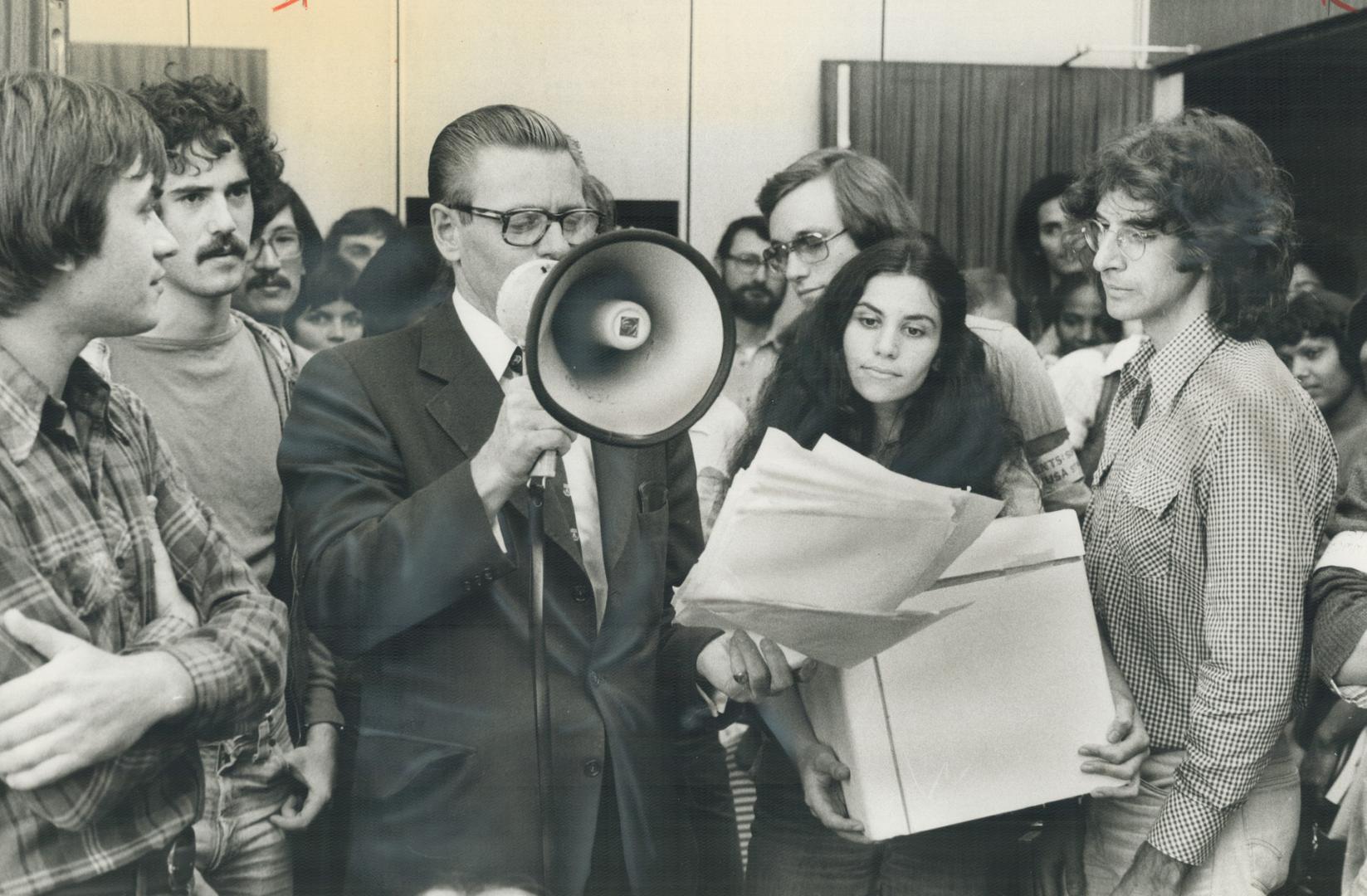 York University president Ian Macdonald talks to students who occupied his office to protest strike