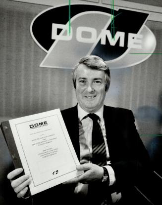 J. Howard Macdonald: Dome Petroleum's chairman has taken some of the dreams out of the company, but has injected more security. Here he holds Dome's debt payment agreement.