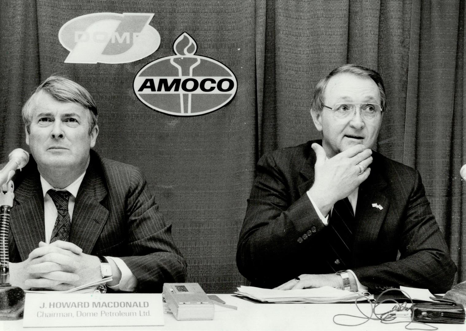 Will it fly? Dome Petroleum chairman Howard Macdonald, left, and Amoco Canada president Don Stacy spent four hours yesterday outlining for creditors the terms of Amoco's offer for shattered Dome Pete