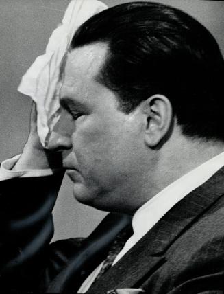 Health minister Allan MacEachen. He sweated under television's hot lights