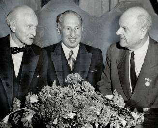 Lt.-Gov. Mackay with two predecessors. Two former lieutenant-governors of Ontario, Dr. Herbert Bruce, left, and Ray Lawson, flank Lt.-Gov. Keiller Mackay at annual Royal Winter Fair luncheon. They were three of the many well-known dignitaries attending the luncheon which each year helps to get the huge agricultural fair going in fine fashion