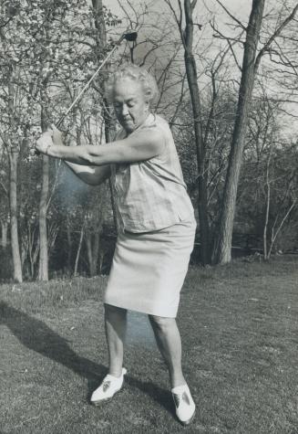 Veteran golfer Ada MacKenzie, who will be 80 in October, finds Bermuda shorts or short skirts with fullness at the back are the most comfortable wear on the course