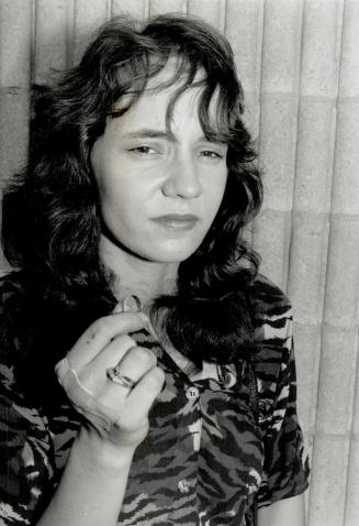 Letitia Mackenzie: Victim's daughter, 20, holds her mom's blood-stained wedding ring.