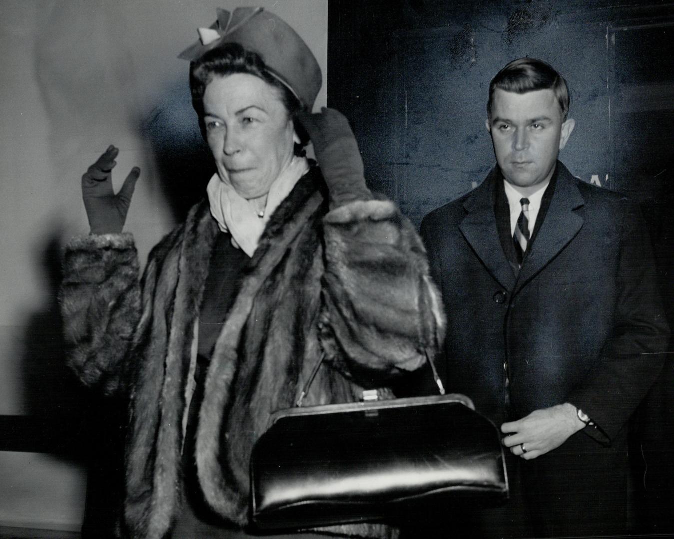 Mrs. Viola MacMillan leaves John Campbell's hearing. She loaned his wife 5,000 shares. I wasn't in habit of doing that.