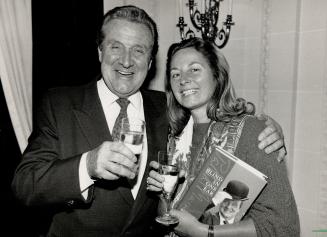 Toast to success: Patrick Macnee and publisher Anna Porter celebrates the launch of the actor's autobiography at party in Sutton Place.