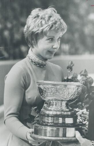 Queen of the blades: Beautiful Karen Magnussen, 19, of Vancouver holds trophy won at London, Ont