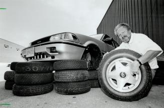 Tread truths: Wheels tire tester John Mahler poses with the rubber he put through the wringer using Chevlot Diplomat alloy wheels and this trusty Toyota Corolla LE