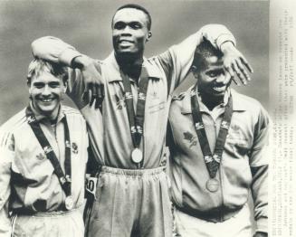 Above the rest: Canada's Atlee Mahorn, winner of the gold medal in the 200 metres at Commonwealth Games, nonchalantly plants his arms on silver medalist Todd Bennett of England, left, and Canadian Ben Johnson, who won the bronze
