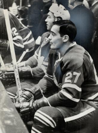 Tension shows on the Big M. Mahovlich watches action from bench