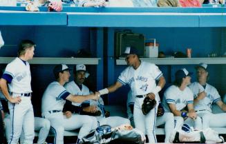 Welcome aboard: Joho Olerud (left) welcomes Candy Maldonado to the Blue Jays while Pat Tabler (right) seems to be asking Kelly Gruber who the new guy is