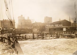 Image shows the view from the boat towards the Harbour buildings.