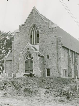 Image shows the front of a church building.