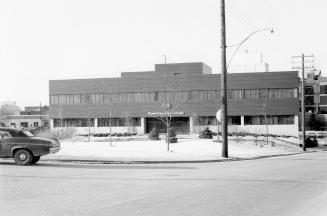 A large blocky building with Rowntree Macintosh above the central doorway. There is snow on the…