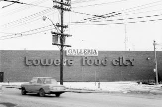 Signs for Tower's and Food City stores, Galleria shopping centre, Dupont Street, south side, between Dufferin Street and Emerson Avenue, Toronto, Ont.