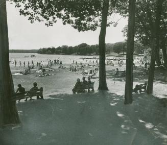 Time for frolic in the water or relaxation on the beach bench at the Midland Municipal Park, a holiday stopover point for sun and sand worshippers of all ages
