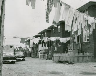 Clothes lines strung up between row houses in Mimico, Ont.