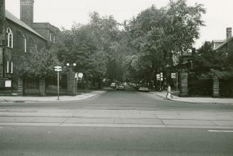 Palmerston Boulevard, looking north from College Street, showing gate posts on the north side of College Street.