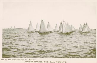 Image shows numerous boats in a racing process.