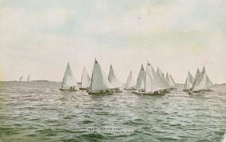 Image shows a number of boats on the lake.