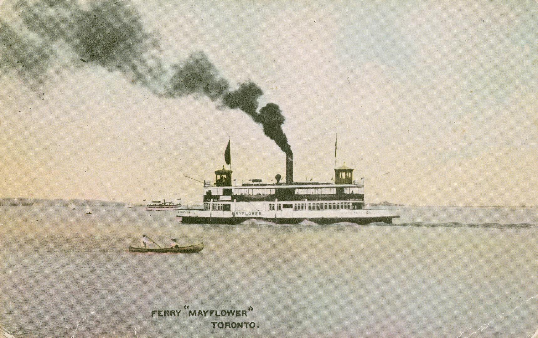 Image shows a lake view with a ferry boat in the background.