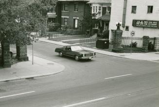 Car at the corner of Palmerston Boulevard & Bloor Street West.