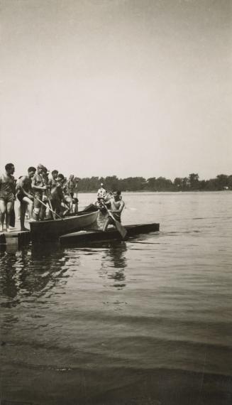 Jack Frizelle and other members of Balmy Beach Canoe Club, Canadian Canoe Association championship regatta, RiviÃ¨re des Prairies, MontrÃ©al, Quebec, 1937