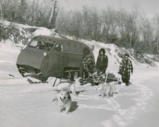 Snowmobile and dogsled at Moosonee, Ont.