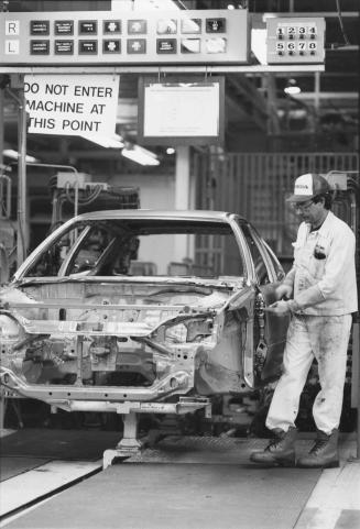Honda Civic rolling down assembly line at Honda plant, Alliston, Ontario