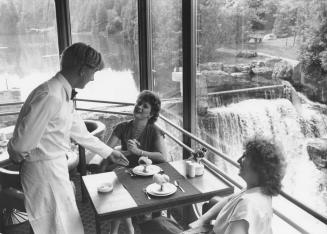 Lynda Sutton and Bernice Mount lunch in the pod overlooking the falls on the Credit River (sic), Alton, Ontario