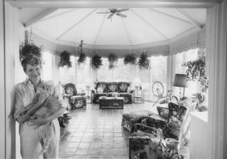 Owner of Ballymore Farm, Yvonne Hadley stands at the entrance to the sunroom, Aurora, Ontario