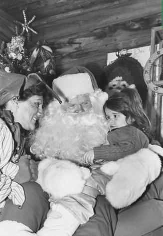 Santa and elf with child, Bancroft, Ontario